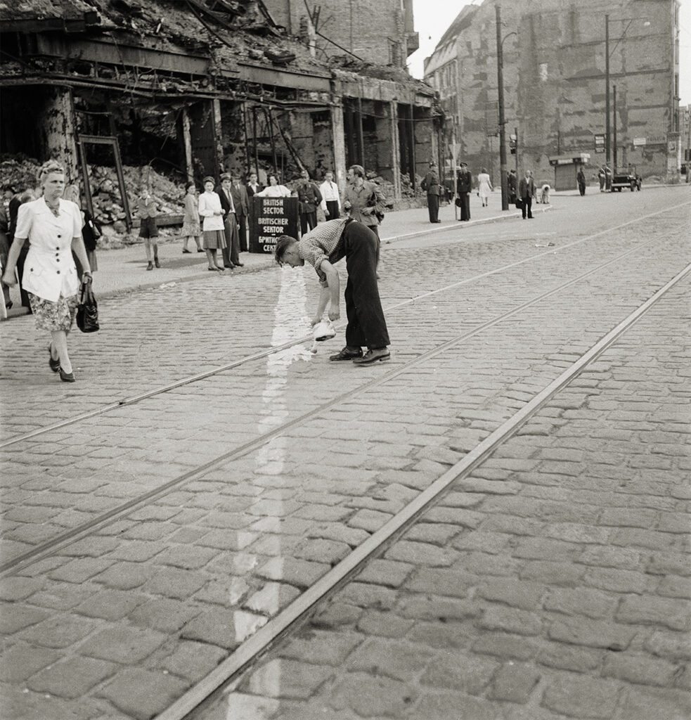 Photo of the actual border line is painted across the Potsdamer Strasse, Berlin, on the order of the British authorities. This action follows incidents in which the Russian-controlled German police made illegal entries into the Western Zone, in their raids on Black Market activities.
