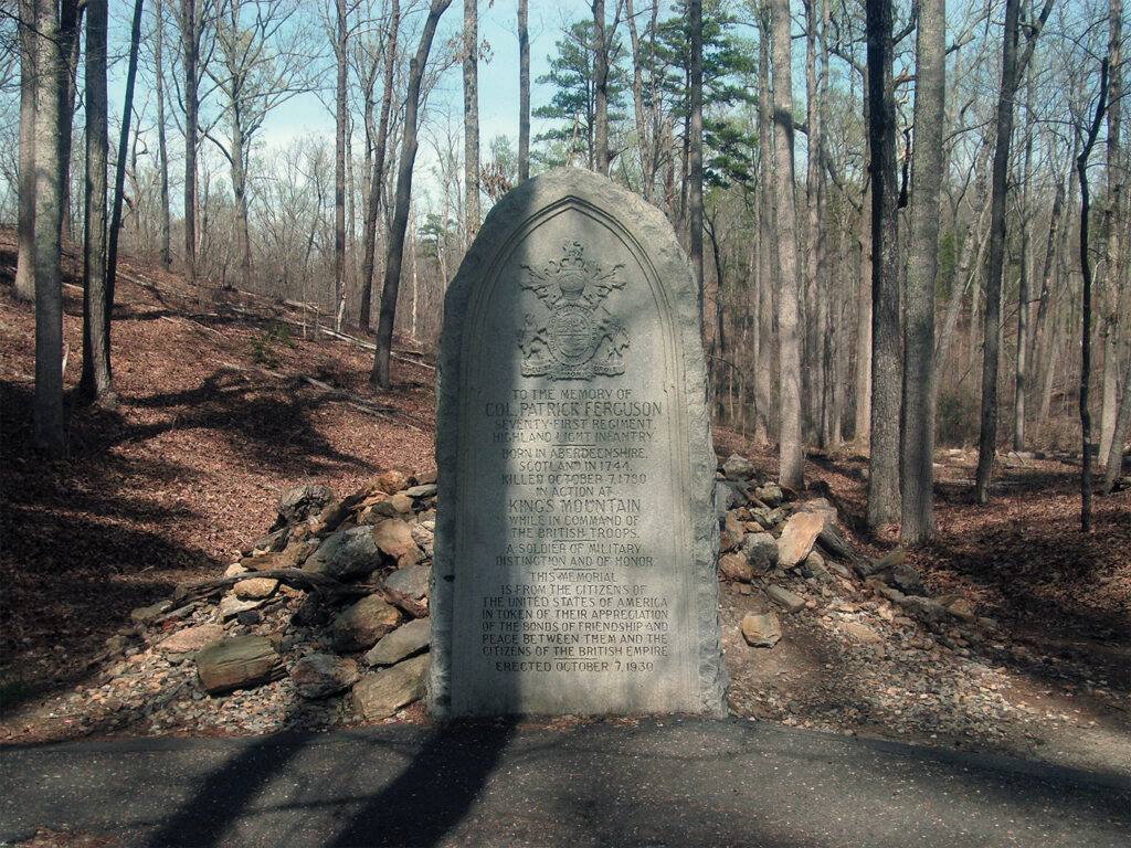 Photo of, Ferguson is buried where he fell, beneath the stone cairn behind this marker at Kings Mountain National Military Park, near Blacksburg, S.C. He shares the grave with one “Virginia Sal,” possibly a camp follower.